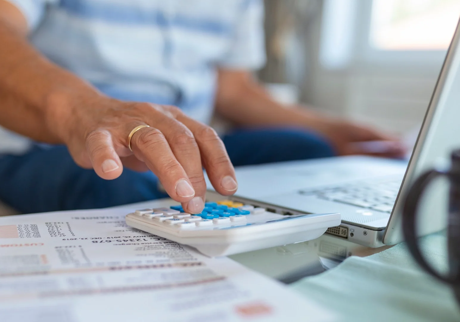 Man calculating his expenses.