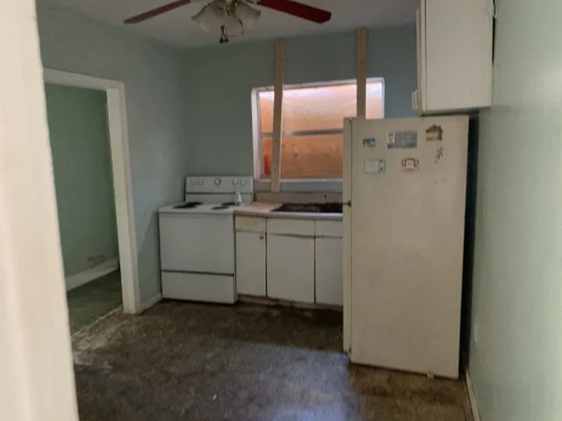 Before: neglected kitchen in a Miami duplex we bought